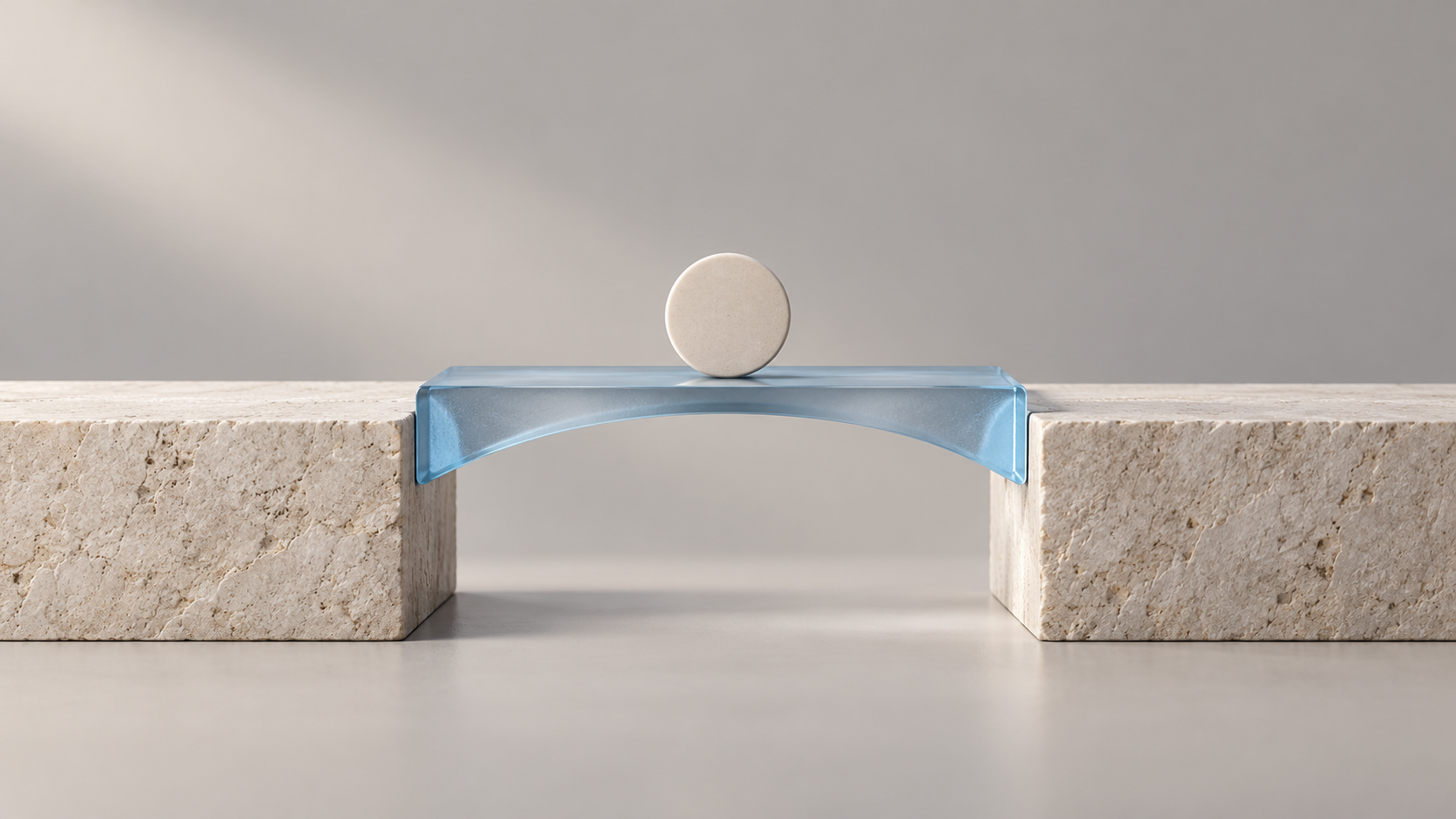 Conceptual sculpture of a plain ceramic disc on a blue glass bridge between limestone supports.